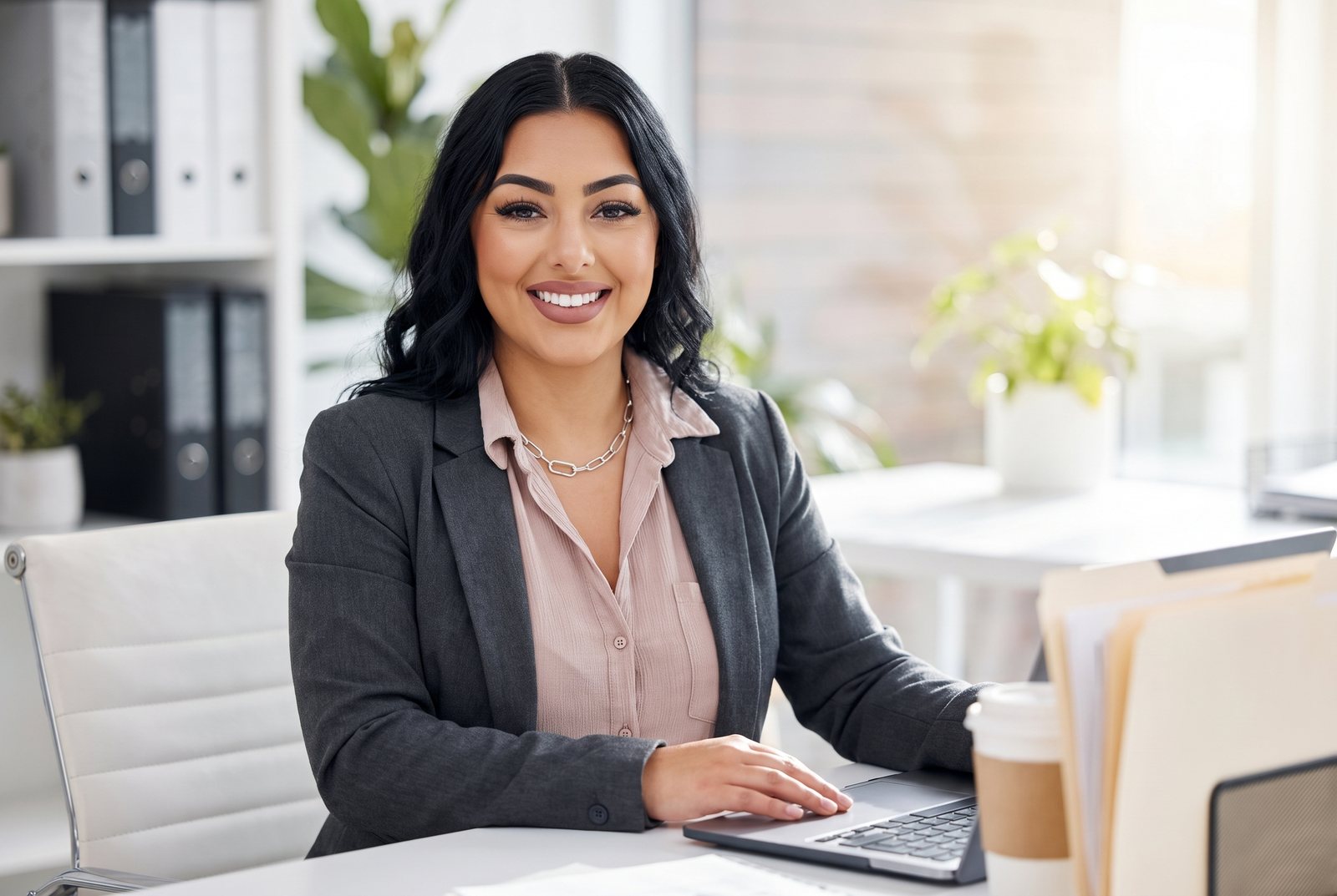 Esmeralda working with billing records at her desk in the E Med Pro Services office, Las Vegas